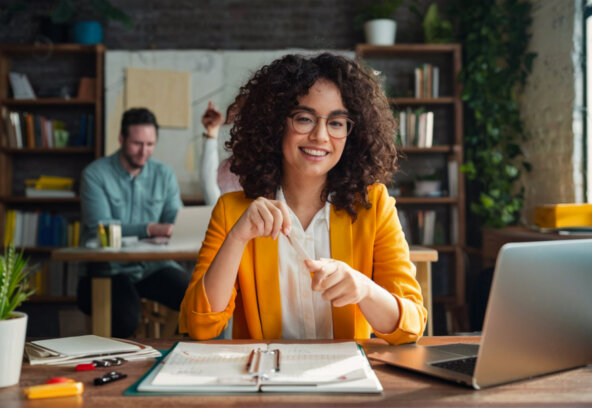 woman-sits-table-with-laptop-man-her-is-looking-her