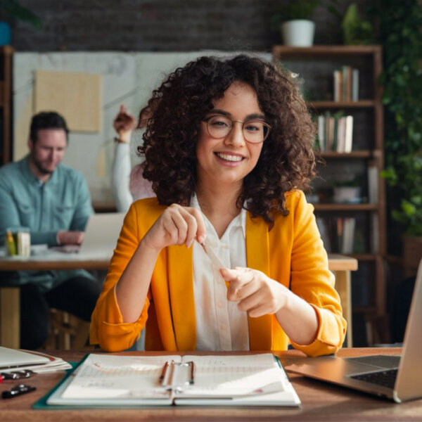 woman-sits-table-with-laptop-man-her-is-looking-her